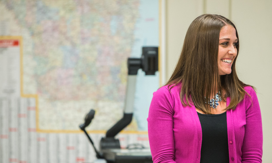 A student in Carthage's Adult Undergraduate Studies program presents during a class.