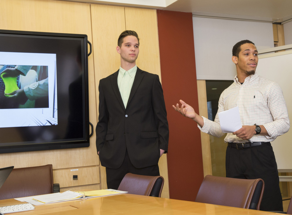 Students pursing a marketing major at Carthage College presenting a project in the Troha Boardroo...