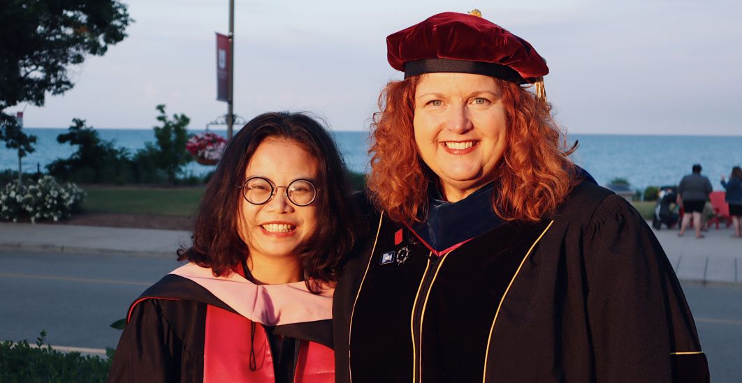 Prof. Corinne Ness with a student at Commencement.