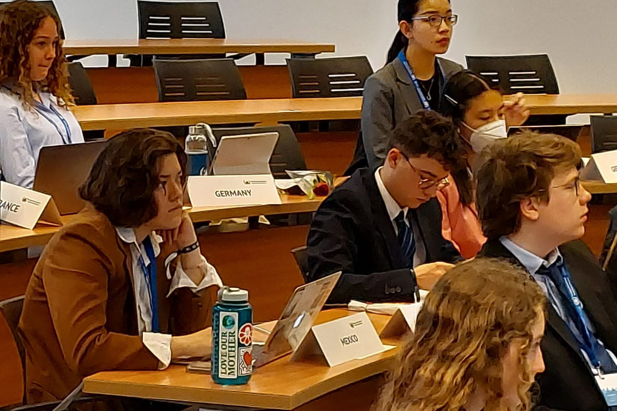 Zoe Moreano ?23 (in brown) and Maya Zenner ?25 (in grey) at the BIMUN Conference in Spain.