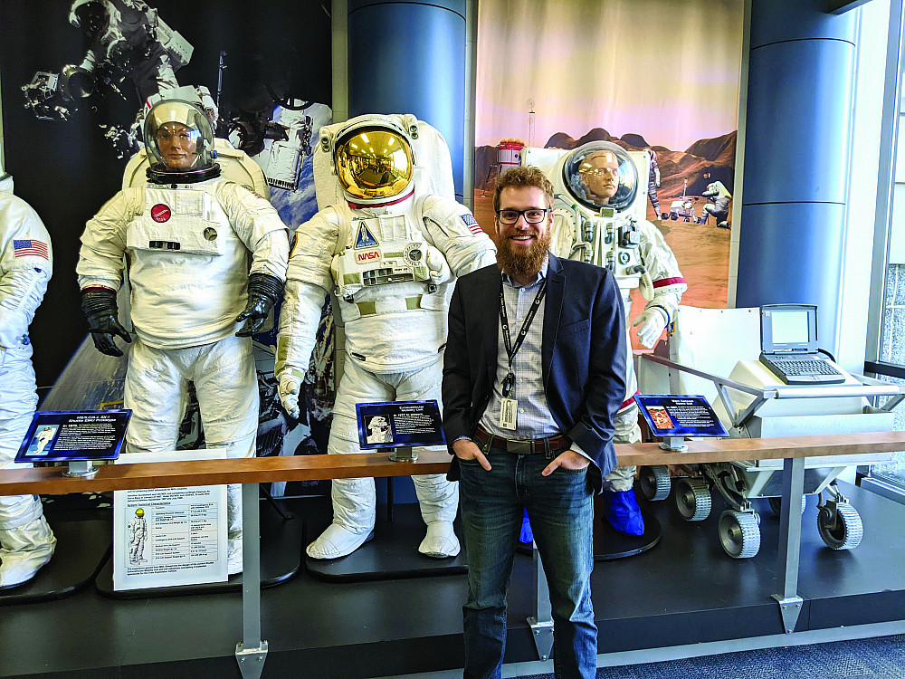 Hunter Sandidge '15 at the entrance to a Collins Aerospace facility