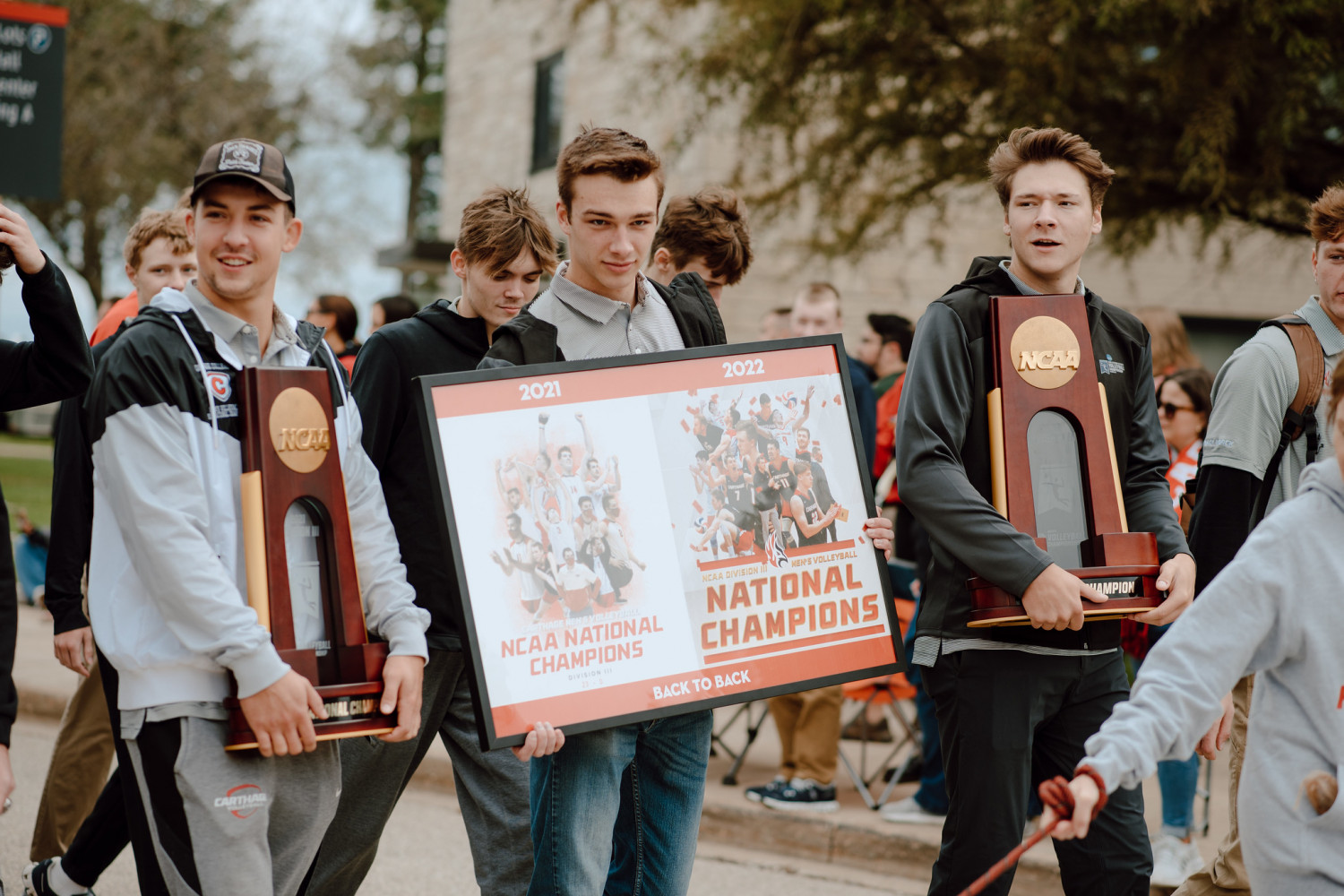Carthage?s National Champion men?s volleyball team walked in the Homecoming Parade with their tro...