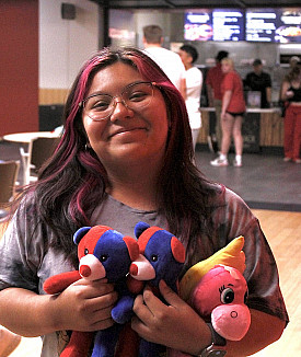 First-year Carthage student holds stuffed animals