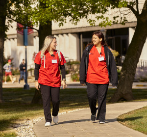 Nursing students walking outside.