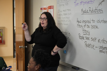Professor Colleen Palmer brings up a discussion point during a talk by Matt Thome '17 in her Cris...