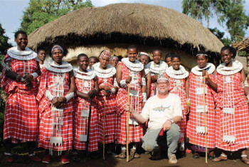 Professor Peter Dennee meets with members of a Maasai women's group to discuss and record their m...