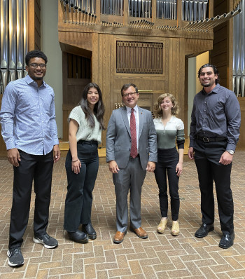 Four outstanding members of the Class of 2023 joined President John Swallow (center) as speakers ...