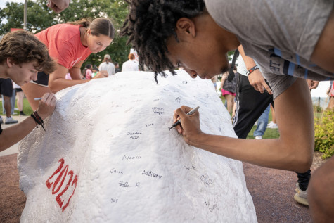 Incoming students in the Class of 2027 signed Kissing Rock, a Carthage tradition.