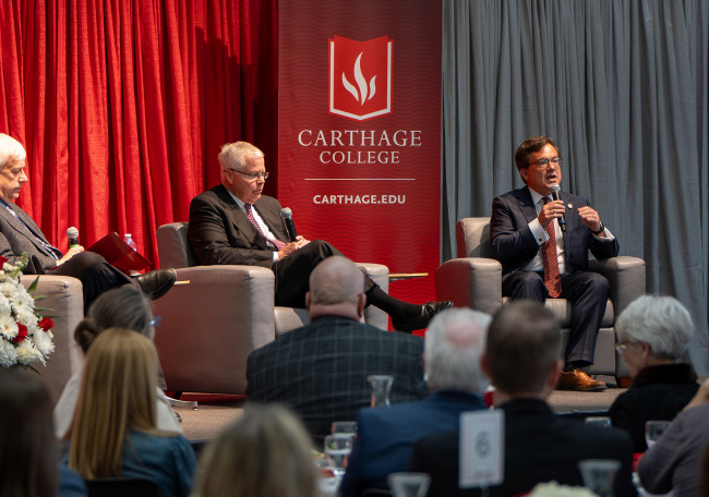 Carthage president John Swallow, right, speaks during ?The Future of Education,? an April 18 even...