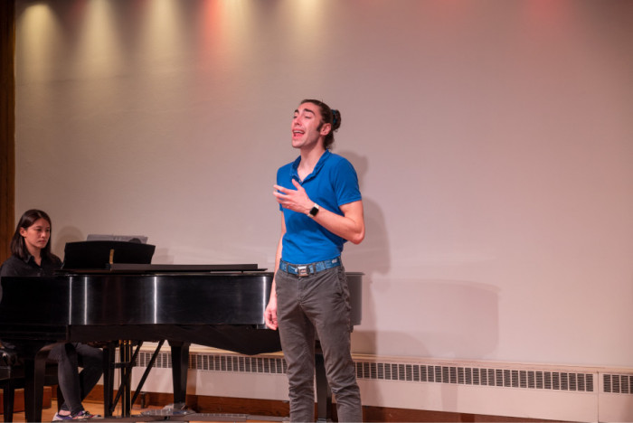 Student singing in the H. F. Johnson Recital Hall.